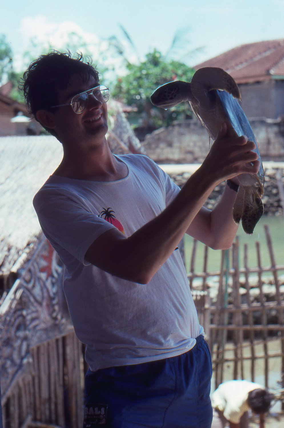 Cruise to Turtle Island. Glenn holding a turtle. Bali vacation, October 1988.