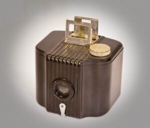 An early compact camera by Kodak. The view finder was a crude pop up pair of metal frames which was just a guide to what your were shooting.