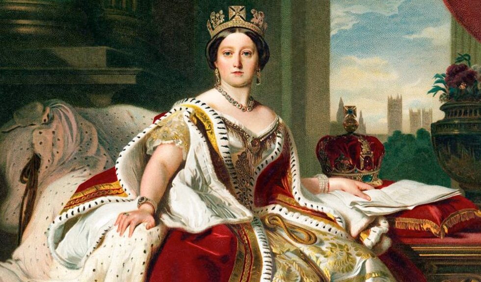 Queen Victoria sitting on a bed