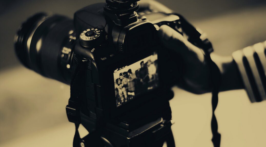 Grayscale Photography of Person Holding Black Dslr Camera. Photo: Md Iftekhar Uddin Emon