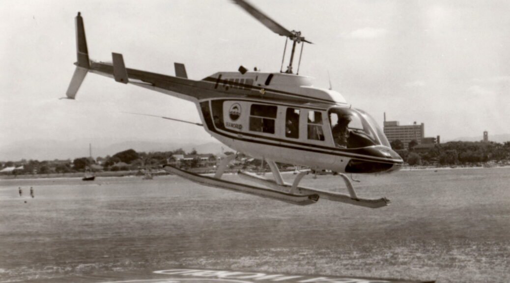 Seaworld's Bell 500 helicopter beginning a joy flight. Seaworld. Queensland Holiday,  1979.