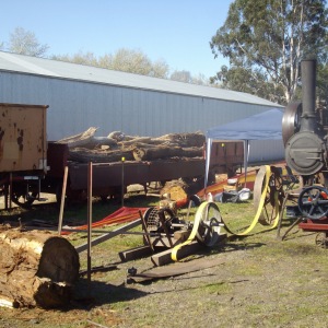 Wood cutting demonstration using a portable steam engine.