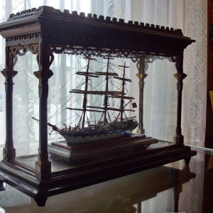 Model sailing ship in a cabinet