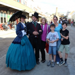 Family posing with some of Sovereign Hill's period actors