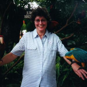Karen holding some beautiful parrots